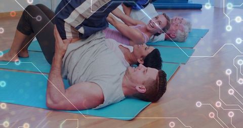 Group Fitness Training with Supportive Instructor and Enthusiastic Participants