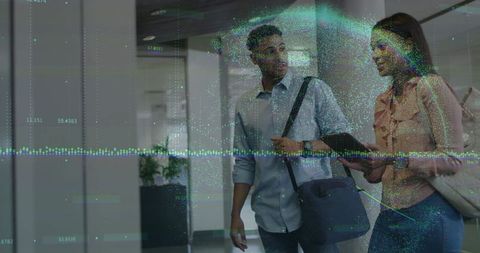 Colleagues Consulting Tablet with Data Overlay at Airport Passageway