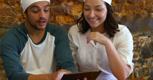 Young Culinary Team Collaborating Using Digital Tablet for Recipes - Download Free Stock Images Pikwizard.com