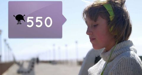 Young Woman Enjoying Music While Engaged in Data Concept