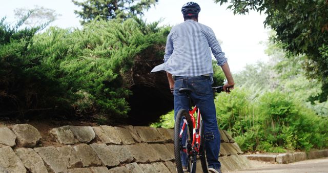 Man Riding Bicycle Outdoors in Nature Park - Download Free Stock Images Pikwizard.com