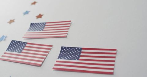 Patriotic Arrangement of American Flags with Stars on White Background