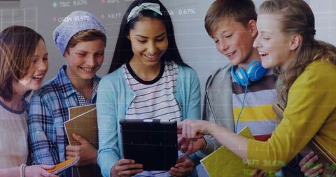 Diverse Students Collaborating on Tablet in Modern Classroom, Learning Together