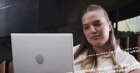 Focused Woman Programmer Coding in Innovative Office