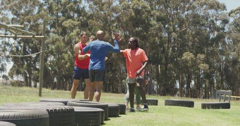 Diverse Athletes Bonding during Outdoor Tire Workout - Download Free Stock Images Pikwizard.com