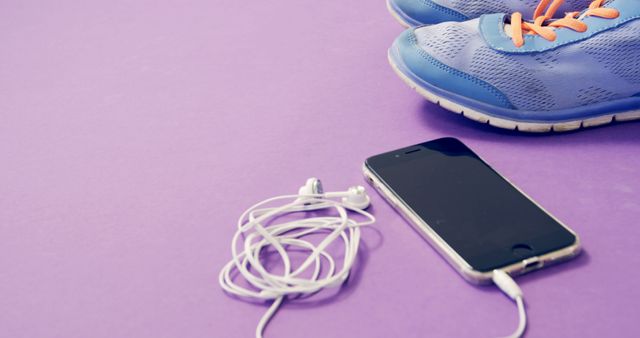 Running Shoes along with Headphones and Smartphone on Purple Surface - Download Free Stock Images Pikwizard.com