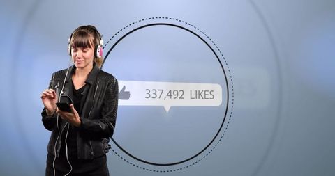 Woman Engaging with Social Media While Listening to Music