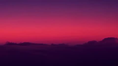 Aerial Sunrise with Colorful Horizon and Cloud Layers