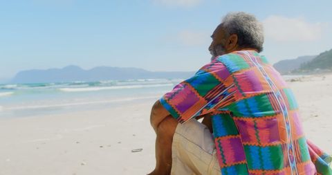 Senior African American Man Relaxing on Sunny Beachside