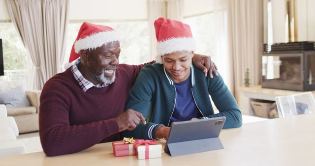 Happy Father and Son Celebrating Christmas Using Tablet - Download Free Stock Images Pikwizard.com