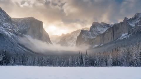 Sunrise Fog Rolling Through Snowy Mountain Valley with Backlit Cliffs and Pines