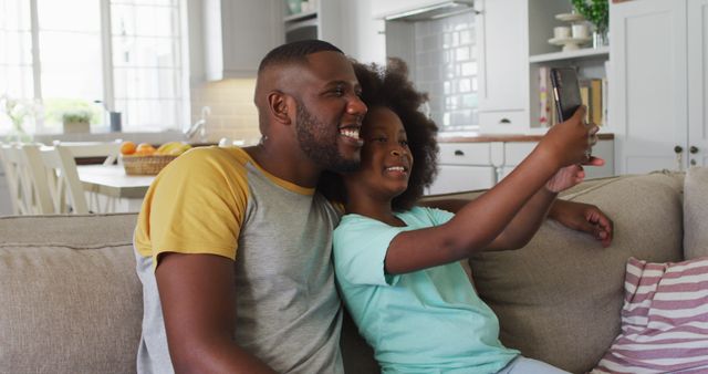 Father and Daughter Taking Selfie in Modern Kitchen - Download Free Stock Images Pikwizard.com