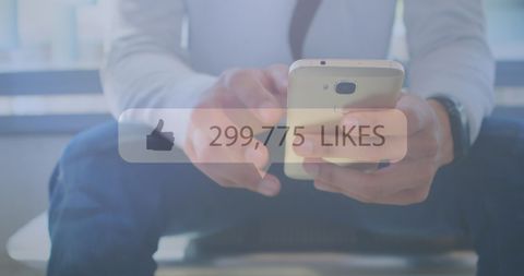 Businessman Interacting with Smartphone Gaining Social Media Likes