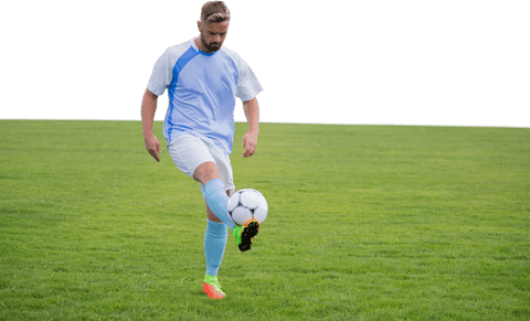 man practicing kicking soccer ball on clear green field - Download Free Stock Videos Pikwizard.com