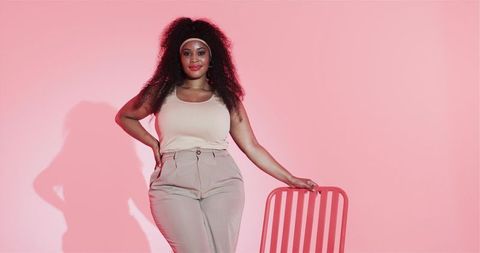 Confident African American Woman Posing in Stylish Fashion Studio