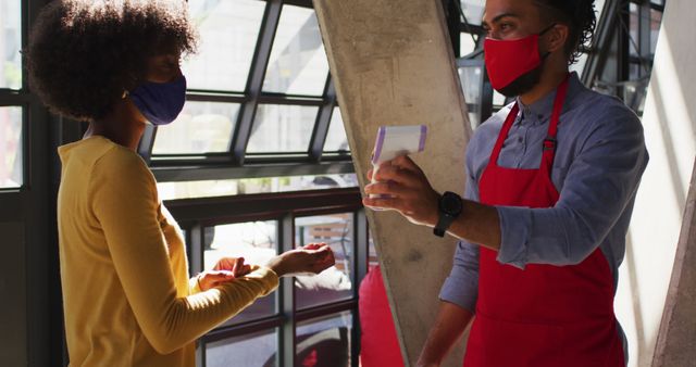 Grocery Store Employee Taking Temperature of Shopper During Pandemic - Download Free Stock Images Pikwizard.com