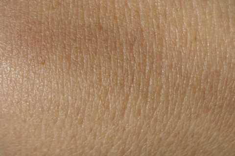 Close-up of human skin texture with natural lighting