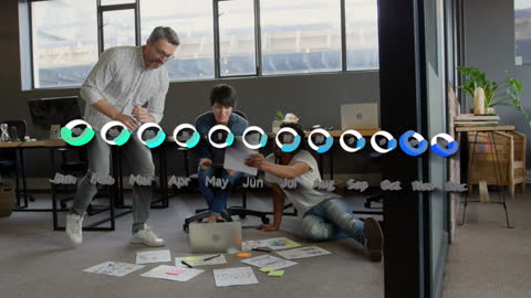 Diverse Team Collaborating on Data in Modern Office