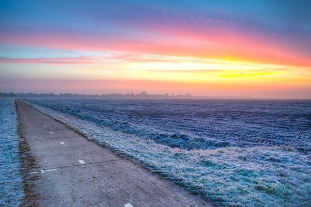 Frosty Rural Road at Dawn with Vibrant Sky - Download Free Stock Photos Pikwizard.com