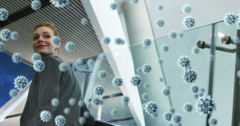 Businesswoman on escalator with digital virus overlay symbolizing pandemic concerns