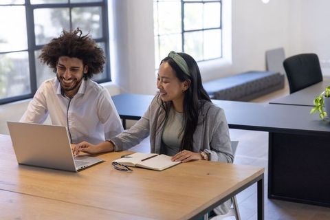 Diverse coworkers engaging in collaborative office work