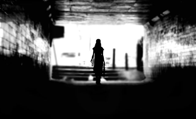 Silhouette of Person Standing in Shadowy Tunnel - Download Free Stock Photos Pikwizard.com