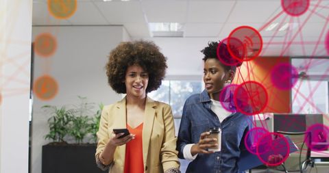 Businesswomen Collaborating on Innovative Digital Solutions