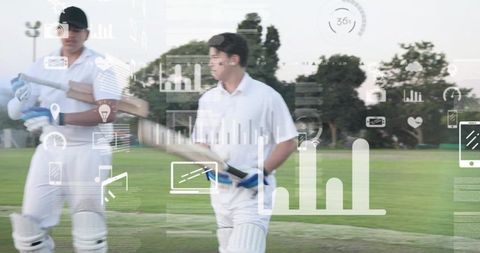 Young cricketers walking on grass pitch with performance analytics overlay