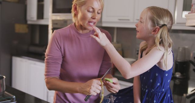 Mother and Daughter Enjoy Bonding Time in Kitchen - Download Free Stock Images Pikwizard.com