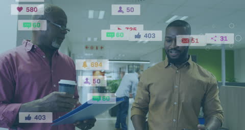 Diverse Colleagues Discussing Digital Engagement in Modern Office