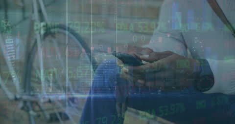 Composite of Stock Market Data and Man Using Smartphone