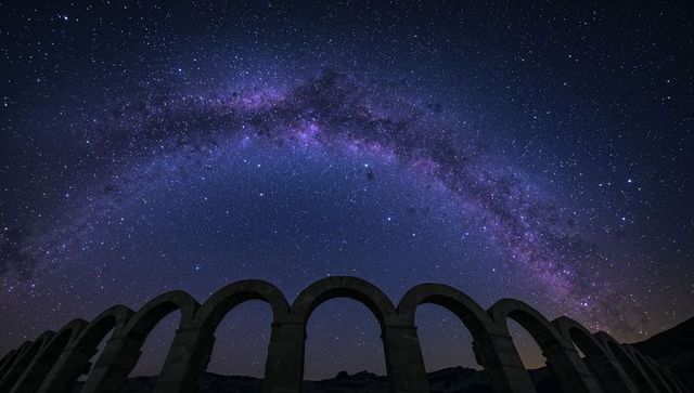 Majestic Milky Way Arches Over Historic Stone Aqueduct