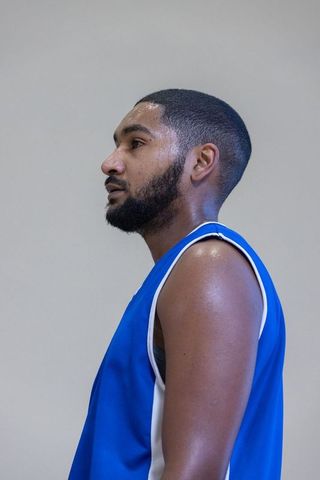 Determined athlete pausing in gym for motivation break