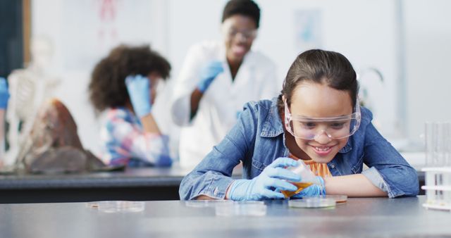 Eager Schoolgirl Conducting Experiment in Science Lab - Download Free Stock Images Pikwizard.com