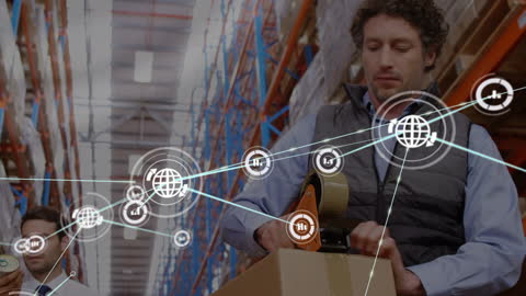 Worker Packing Goods in Digitally Networked Warehouse