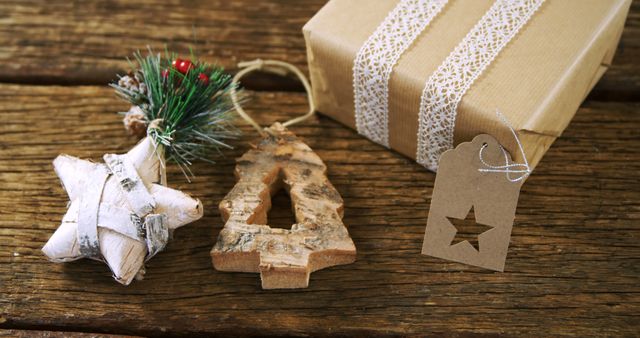 Beautiful rustic-themed Christmas gift presented on wooden surface. Features natural decorations such as wooden star and Christmas tree ornament. Ideal for seasonal brochures, holiday greeting cards, eco-friendly product advertisements, and Christmas websites. Perfect for promoting handmade gifts and sustainable wrapping ideas.