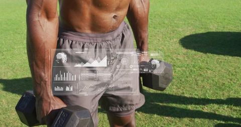 Holding heavy dumbbells on sunlit lawn, muscular man displaying fitness hud overlay training