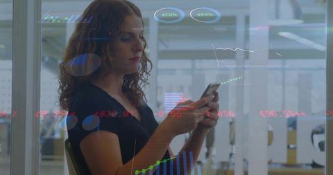 Businesswoman Analyzing Data Charts on Smartphone in Modern Office