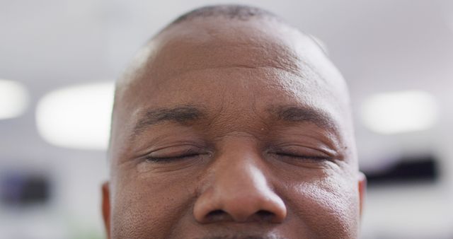 Close up of african american businessman with eyes closed at office - Download Free Stock Photos Pikwizard.com