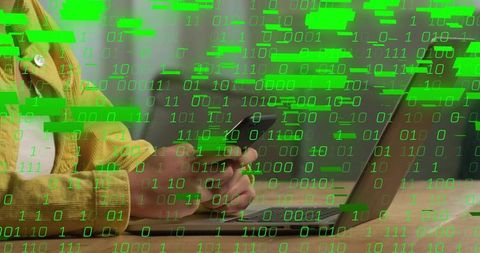 Woman holding smartphone at laptop with green binary glitch overlay for remote work