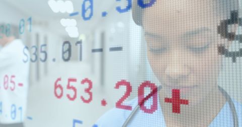 Financial Data Overlay on Focused Female Doctor