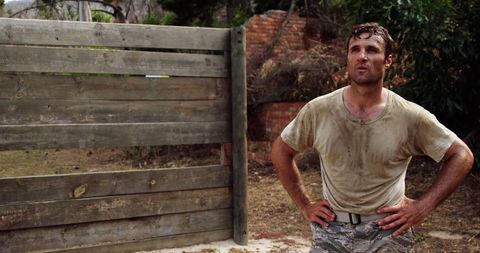 Confident Man in Muddy Attire After Outdoor Activity - Download Free Stock Images Pikwizard.com