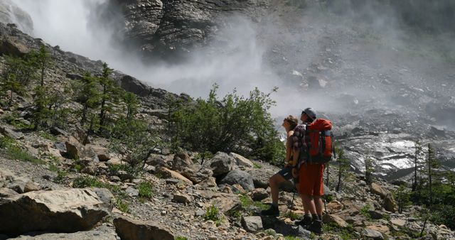 Hikers Exploring Rocky Terrain Near Waterfall - Download Free Stock Images Pikwizard.com