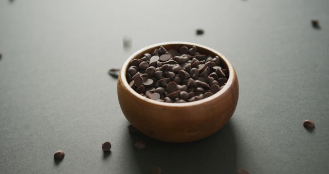 Chocolate Chips in Wooden Bowl on Gray Surface - Download Free Stock Images Pikwizard.com