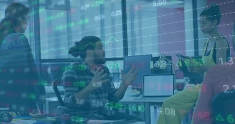 Professionals engaged in dynamic office data discussion