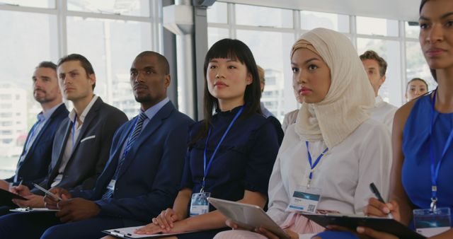 Diverse Business Professionals Attending a Seminar in an Office Setting - Download Free Stock Images Pikwizard.com