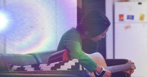 Asian Woman Playing Guitar and Creating Sporting Environment