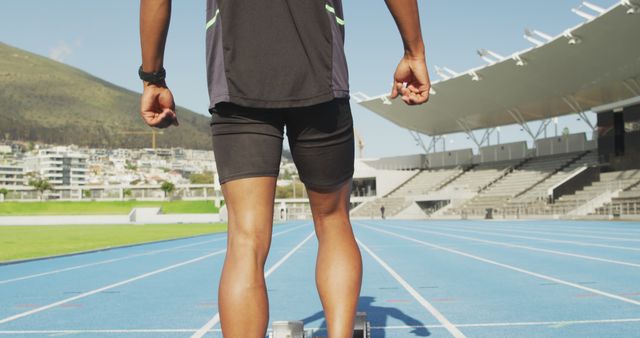 Sprinter Preparing for Race on Outdoor Track - Download Free Stock Images Pikwizard.com