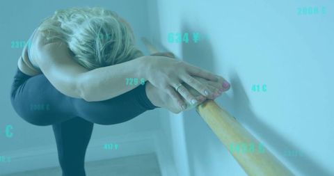 Woman Stretching on Barre with Financial Data Overlay