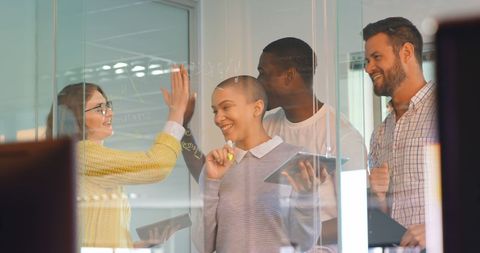 Diverse Business Team Collaborating on Innovative Ideas Behind Glass Board - Download Free Stock Images Pikwizard.com